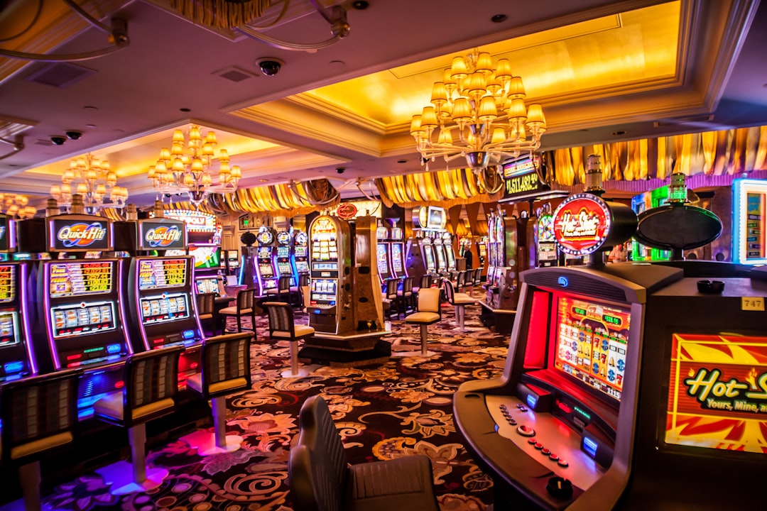 Brightly lit casino interior with slot machines and chandeliers